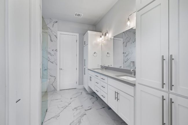 Primary bathroom looking towards walk-in closet | Image 14