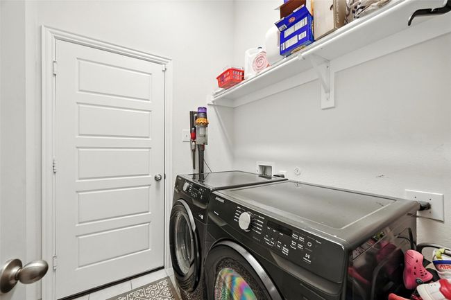 Laundry room with separate washer and dryer and tile patterned flooring | Image 28