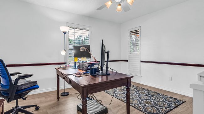Home office featuring ceiling fan and wood finished floors | Image 19
