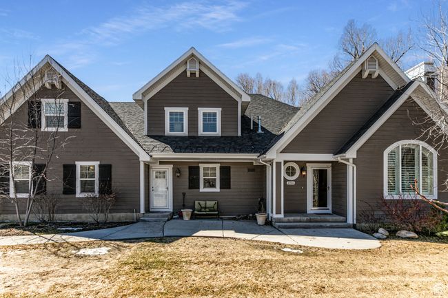 View of front of property featuring a shingled roof and entry steps | Image 55