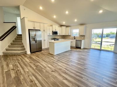 (*Photo of similar home, actual homes colors and finishes will vary) Enjoy lots of natural light and a spacious open plan layout! | Image 2