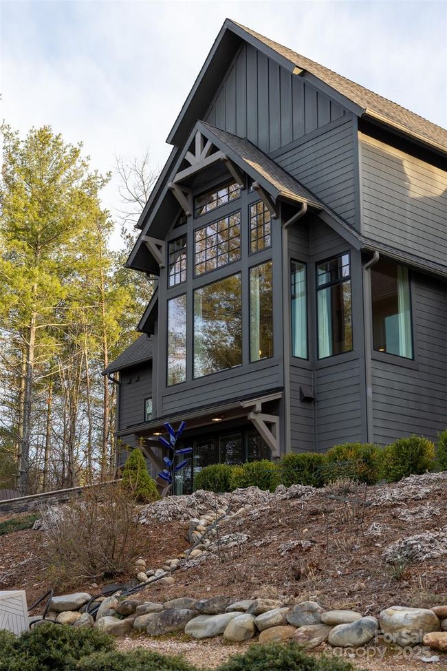 This gorgeous home was designed to capture the best views of the mountains and lake. | Image 32