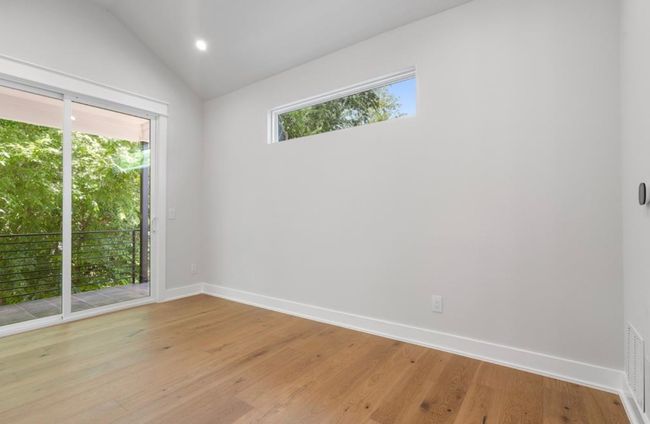 Primary Bedroom with vaulted ceiling, private balcony and tons of natural light! | Image 13