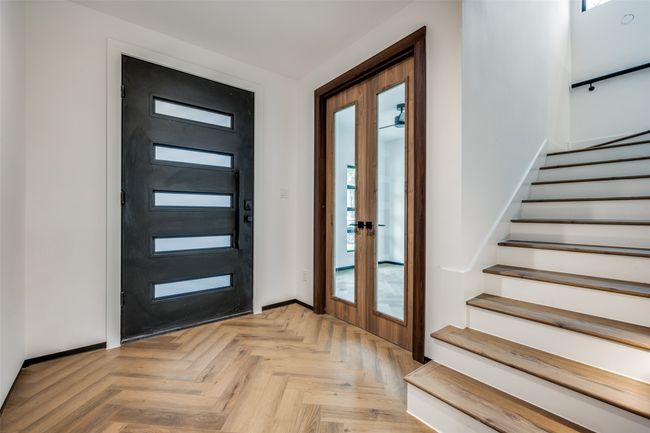 Foyer featuring stairway, french doors, and healthy amount of natural light | Image 5