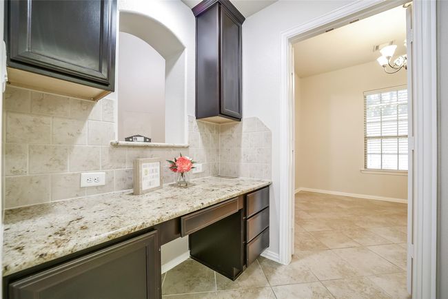 Whether working from home or overseeing homework, this space boasts both functionality and extra storage. Across from here is the formal dining room. | Image 10