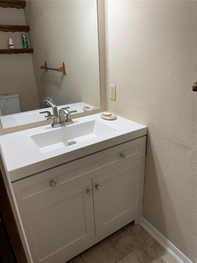 Half Bath downstairs has a brand new cabinet, sink and faucet! | Image 24