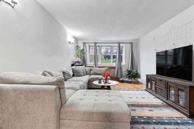 Living area with wood finished floors | Image 5