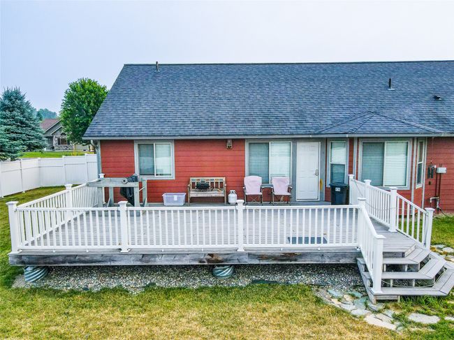 Back of property with roof with shingles, a deck, and fence | Image 29