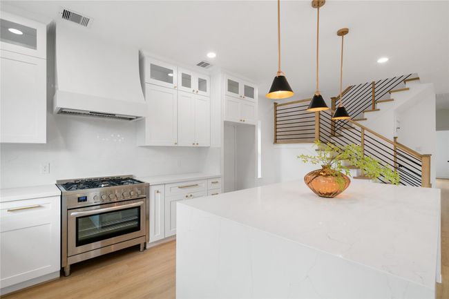Custom vent hood and commercial grade gas range | Image 13