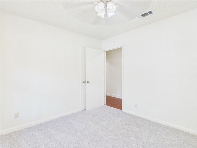 Unfurnished room featuring carpet floors and a ceiling fan | Image 16