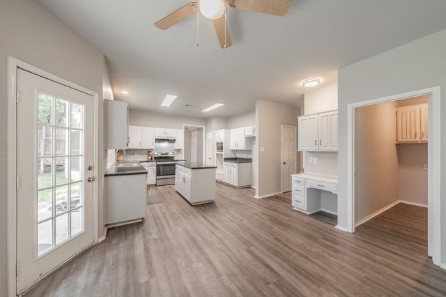 Breakfast area is open to the kitchen & family room. Luxury vinyl wood flooring offers easy care & cleaning. | Image 17