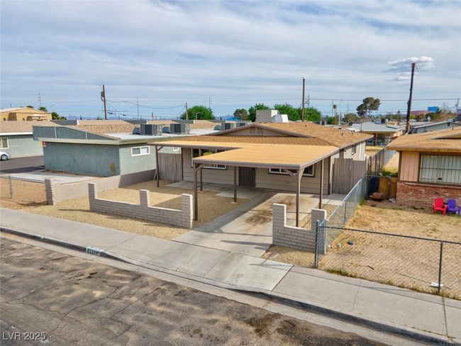 View of front of house with a residential view and a fenced front yard | Image 39