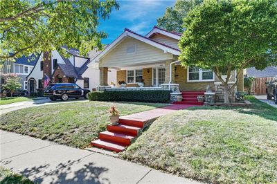 View of front of home with covered porch and a front yard | Image 3