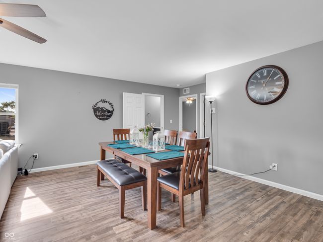 dining room featuring baseboards, ceiling fan, and vinyl floors | Image 10