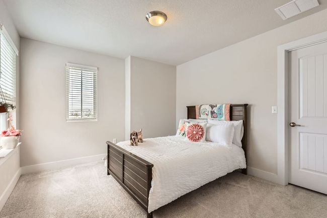Bedroom with light colored carpet | Image 19