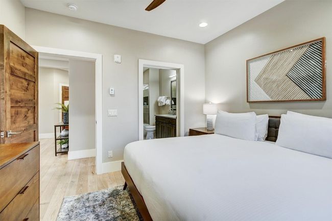 Bedroom featuring recessed lighting, ceiling fan, ensuite bath, light wood-style flooring, and baseboards | Image 23