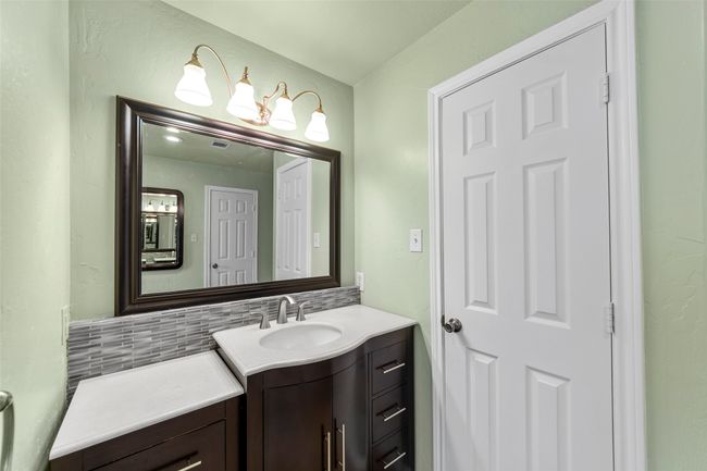 Bathroom featuring tasteful backsplash and vanity | Image 19