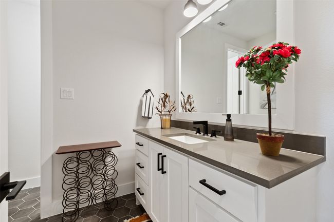 Bathroom featuring visible vents, baseboards, vanity, and tile patterned flooring | Image 27