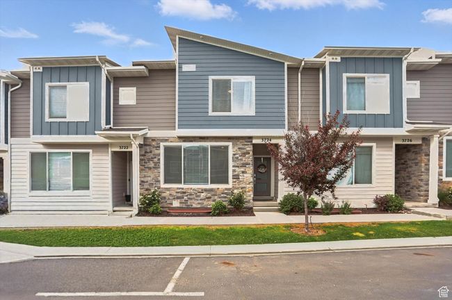 Townhome with board and batten siding and stone siding | Image 24