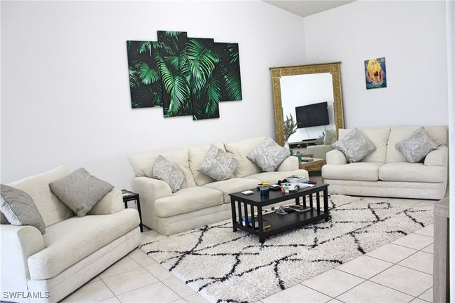 Living room featuring tile patterned flooring | Image 9