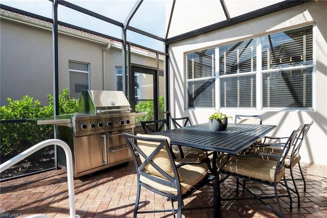 Sunroom featuring outdoor dining area | Image 22