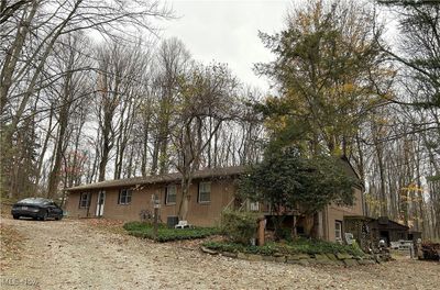 Front view Fall all Brick Ranch home currently used as a Duplex with a walkout lower level. | Image 1