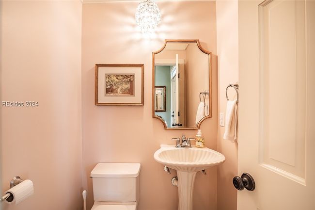 Bathroom with toilet and a chandelier | Image 43