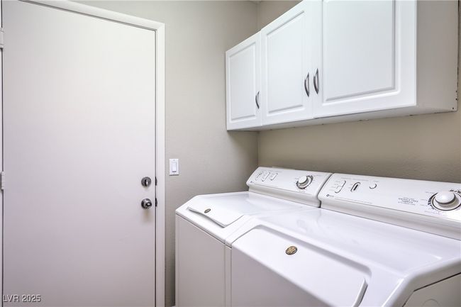 Laundry room with washing machine and dryer and cabinet space | Image 23