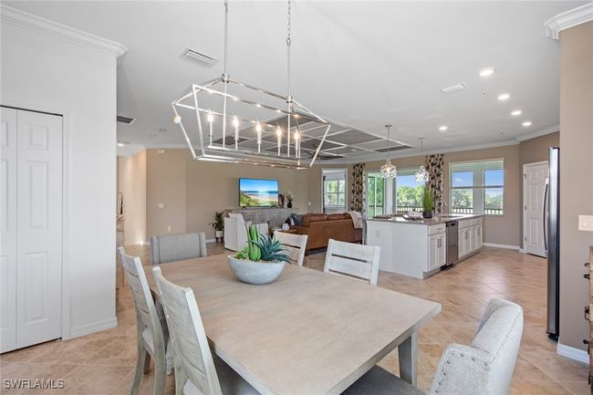 Dining room featuring a chandelier, crown molding, visible vents, and recessed lighting | Image 21