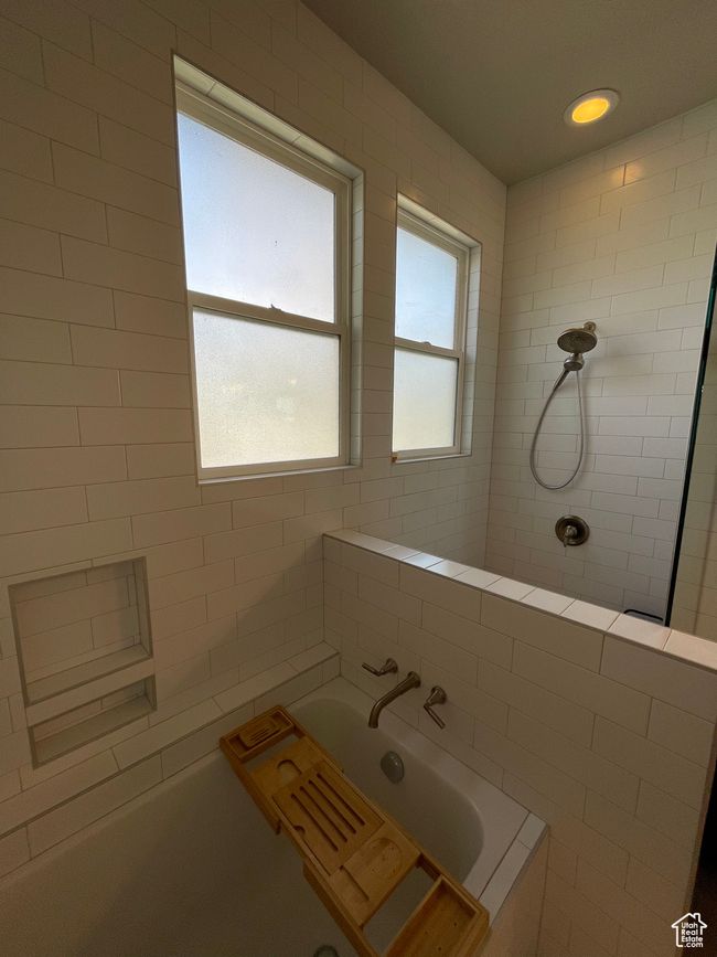 Bathroom featuring a relaxing deep tub and tiled shower newly added | Image 34