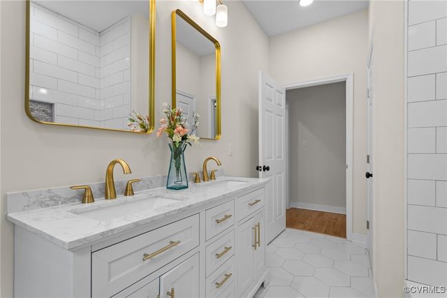 Bathroom featuring double vanity and tile patterned flooring | Image 21