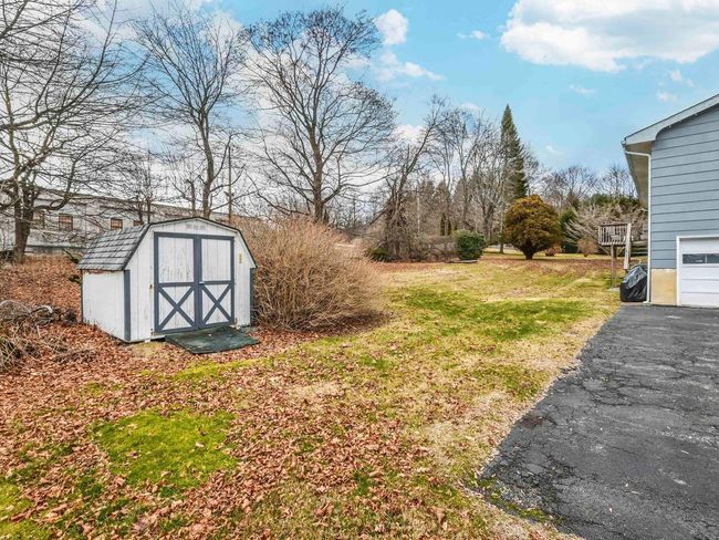 View of yard featuring a storage shed | Image 33