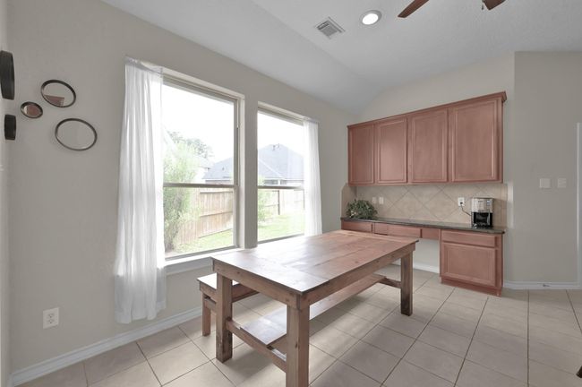 Breakfast room overlooks side yard and family room. Includes BONUS storage desk area or use as a buffet for dishes | Image 8