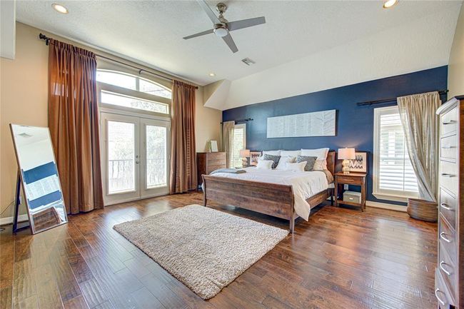 Natural light, a balcony and extra space in this primary bedroom. | Image 13