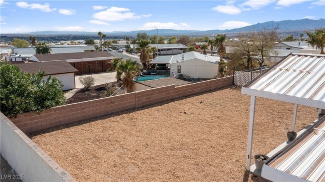 View of yard with a residential view, a fenced backyard, and a mountain view | Image 51