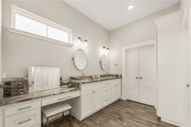 Full bath with double vanity, wood finished floors, and recessed lighting | Image 12