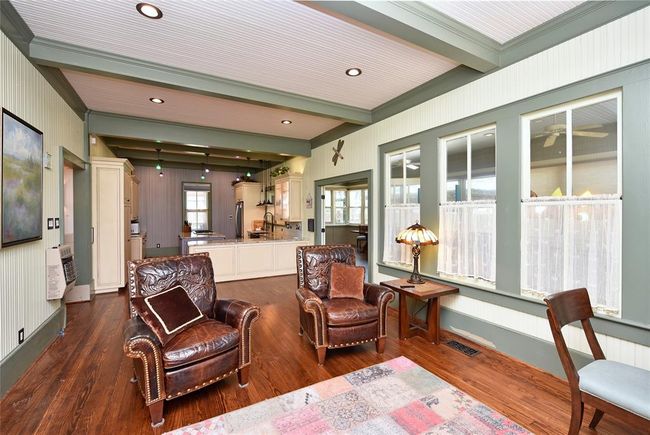 This view of the family room in the Main house shows the family room is open to the kitchn. The recessed lighting was added to brighten this lovely space. | Image 11