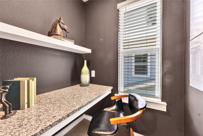 Office space with built in study area and a textured wall | Image 23