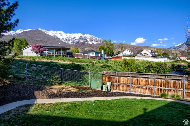 View of yard with fence and a mountain view | Image 41