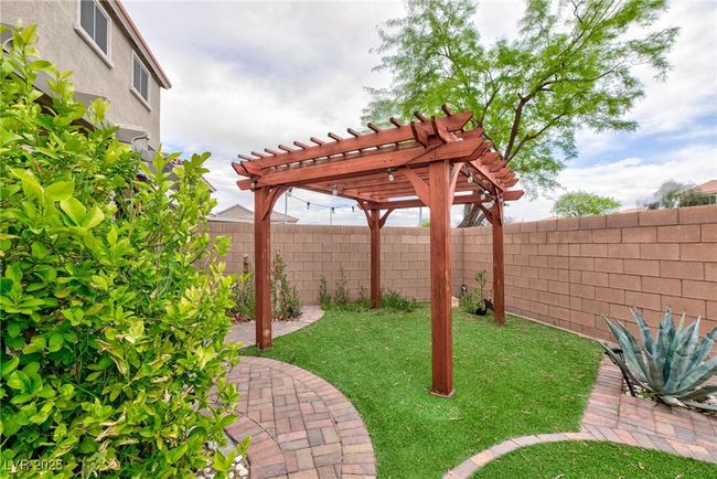 View of yard with a pergola and a fenced backyard | Image 6