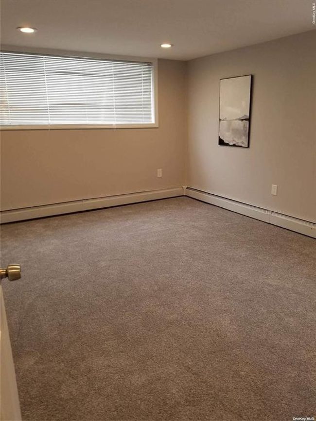 Carpeted empty room featuring recessed lighting | Image 9