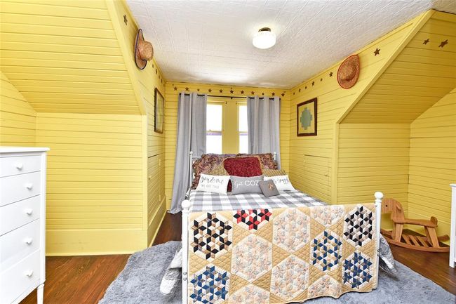 One of the upstairs bedrooms. This is a darling room. Perfect for your guests. | Image 18