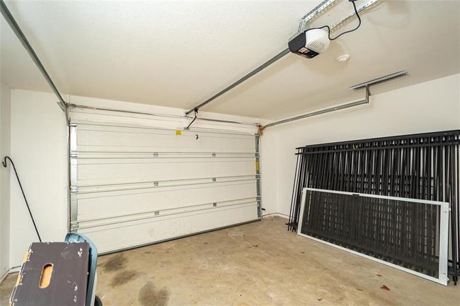 Garage with a garage door opener | Image 38