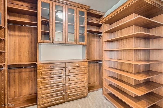 Walk in closet featuring light carpet | Image 21