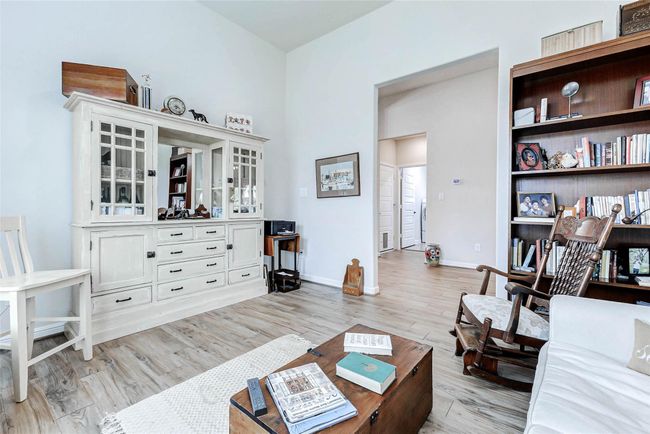 This photo highlights the room’s location within the home—situated just beyond the entryway and before you reach the kitchen, offering easy access and versatility. | Image 13