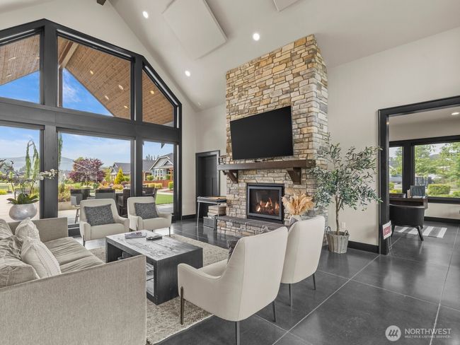 The clubhouse is like a second home. With a welcoming great room, you'll be able to chat fireside with friends, family and neighbors. | Image 27