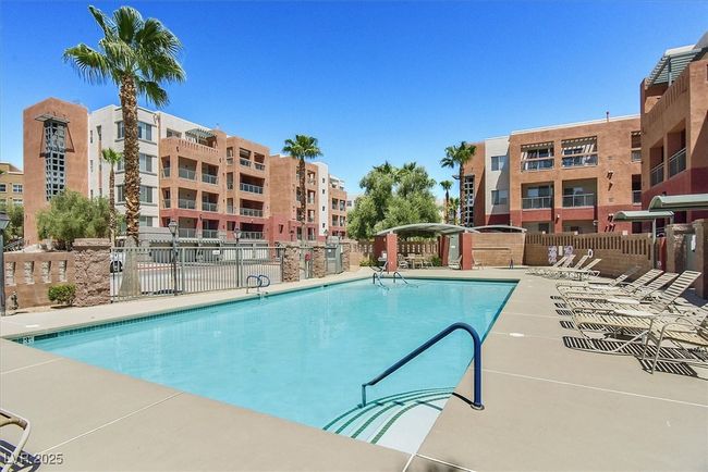 Pool with a patio and fence | Image 23