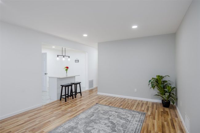 Sitting room featuring light wood-type flooring | Image 8