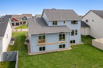 Big backyard for playing! Large windows in lower level and double patio doors on main level for your future deck! | Image 3