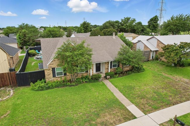 View of front of house featuring a shingled roof and brick siding | Image 4